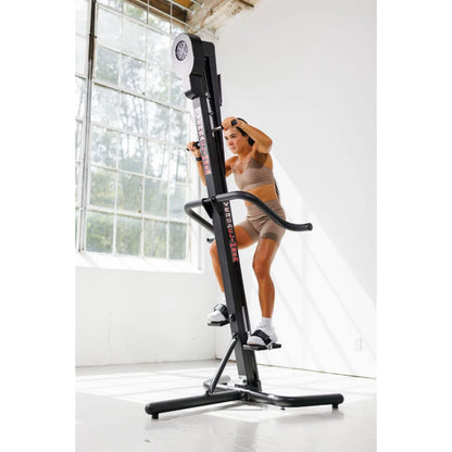 VersaClimber TS Magnetic – top-down shot focusing on foot pedals and rail design during workout