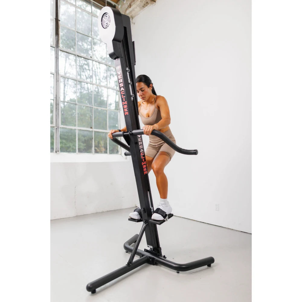 VersaClimber TS Magnetic – climber showcased in boutique fitness space with ambient lighting
