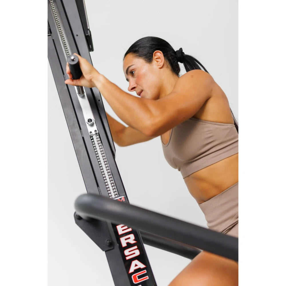 VersaClimber TS Magnetic – climber positioned next to strength equipment for cross-training setup