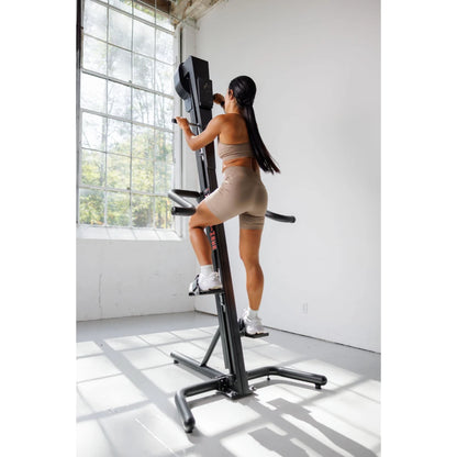 VersaClimber TS Magnetic – athlete cooling down beside climber after intense vertical session