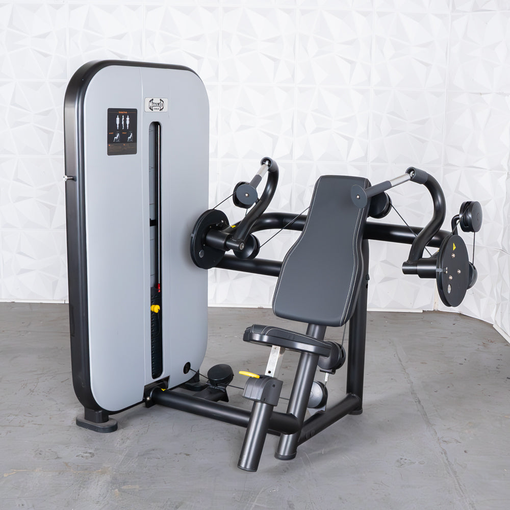 Vogue Triceps Extension machine with padded seat and weight stack.