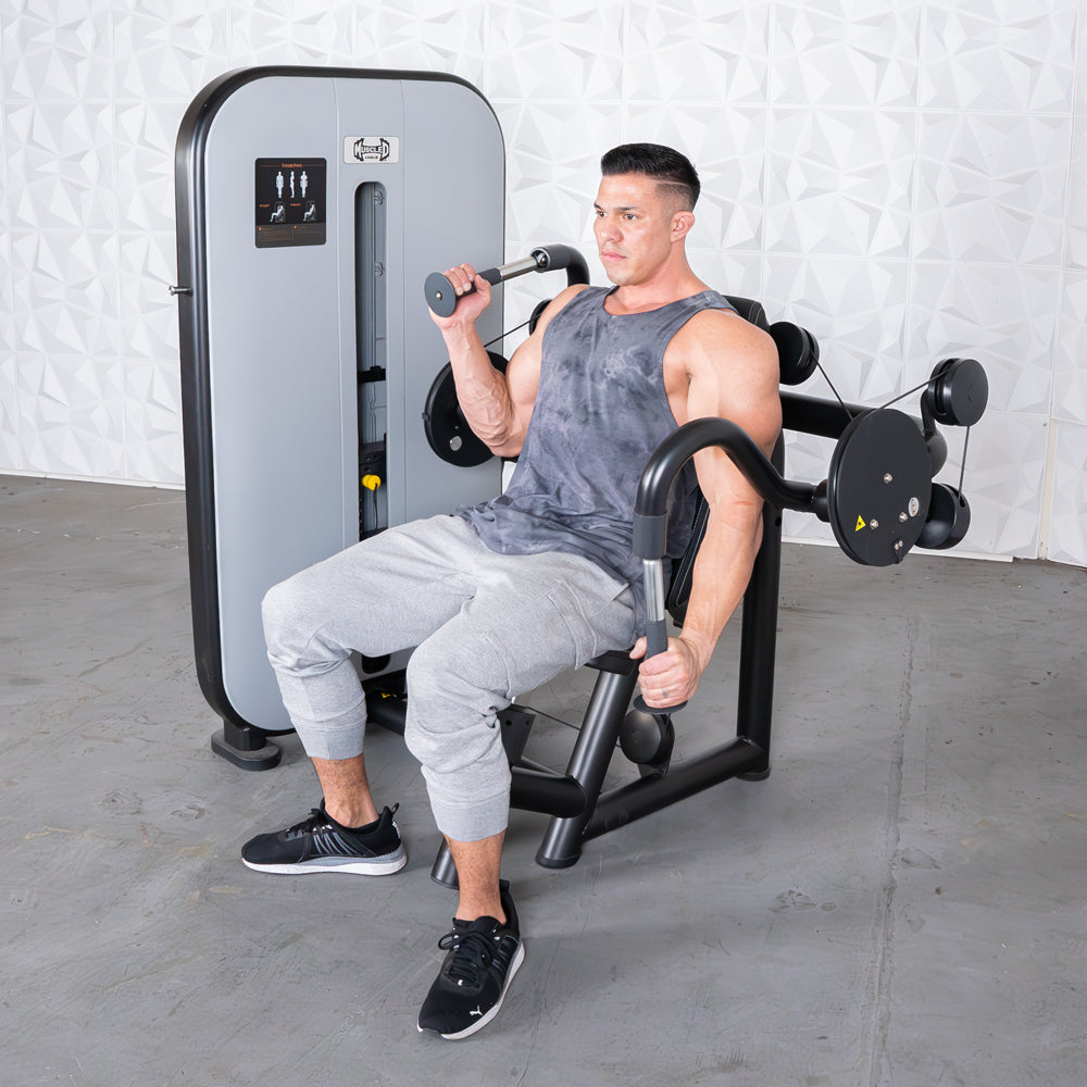 Man using a cable triceps extension machine at the gym.