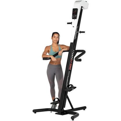 VersaClimber TS Magnetic – woman standing beside white climber lifestyle shot for premium fitness branding