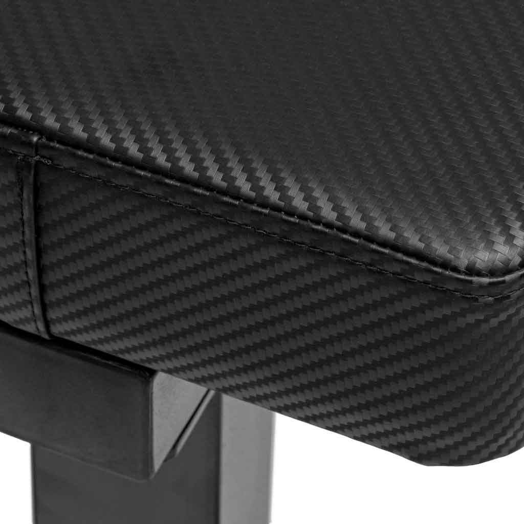 Close-up of carbon fiber textured bench seat with stitching.