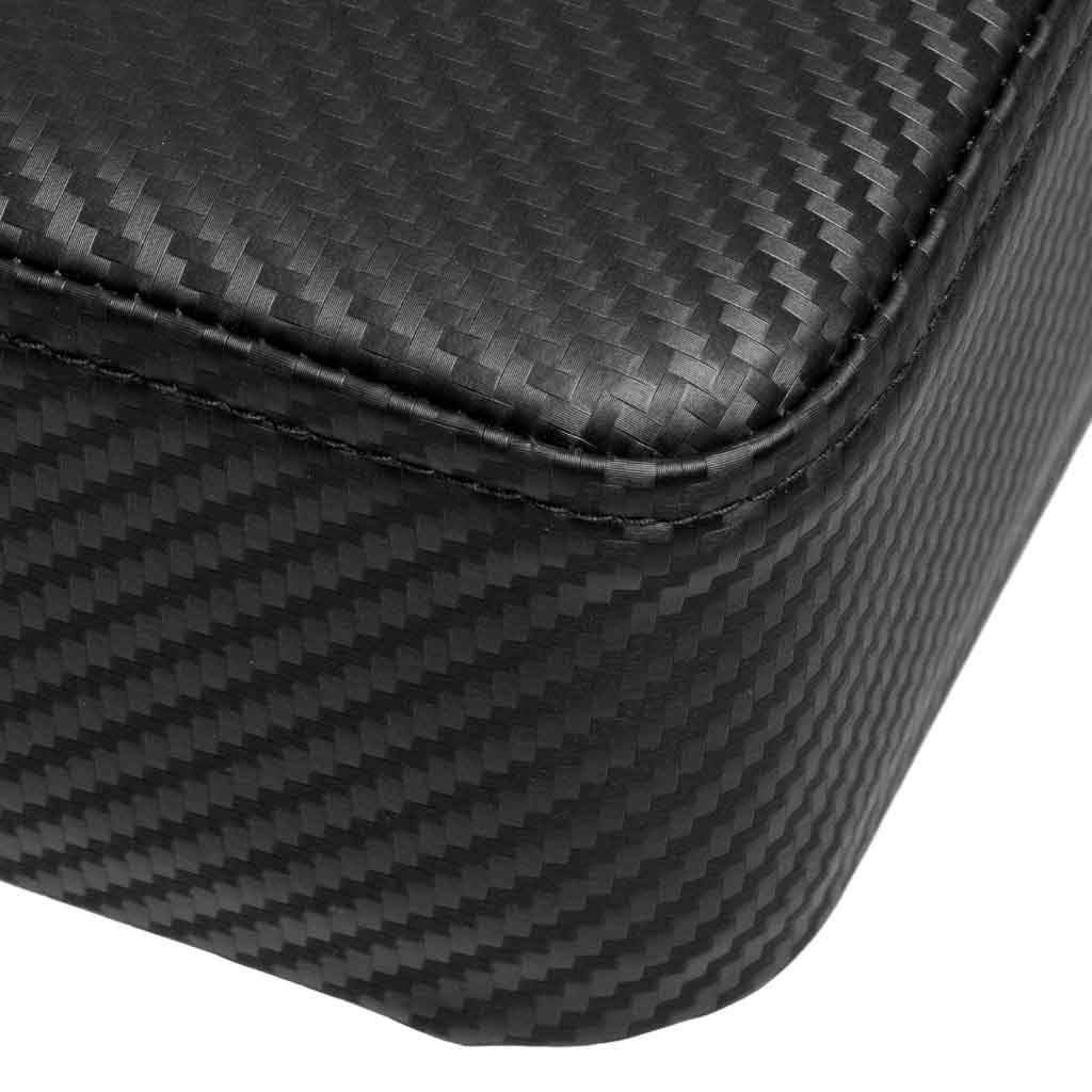 Close-up of black carbon fiber pattern on stitched corner