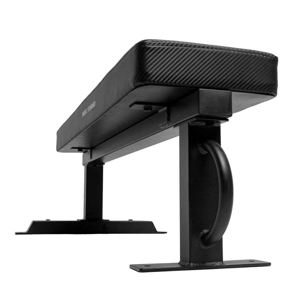 Black padded workout bench with leg curl/extension attachment on stand.