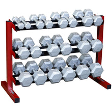 A three-tier dumbbell rack displaying various sizes of hexagonal dumbbells in silver, set against a red frame.