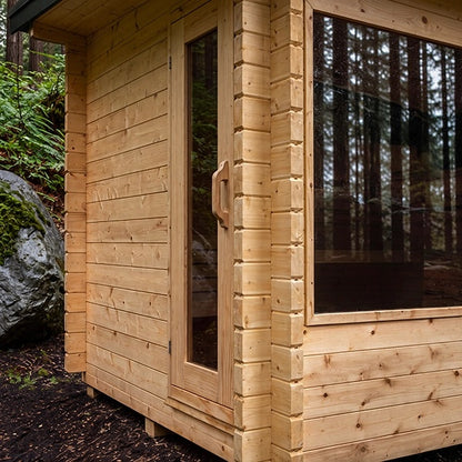 CT Avalon Sauna cedar log walls, glass door, and front window