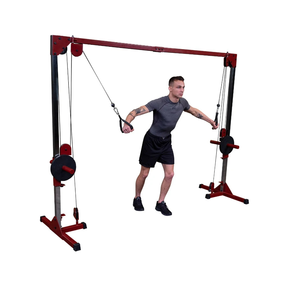A young man with tattoos performing an exercise using a cable machine in a gym setting, showcasing strength training.