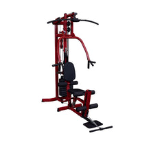 A red multi-gym workout machine with a bench, pulleys, and weights, designed for strength training exercises.