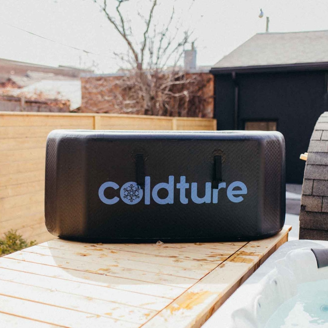 Coldture Classic and Chiller Pro cooler on a wooden deck with a hot tub in the background.