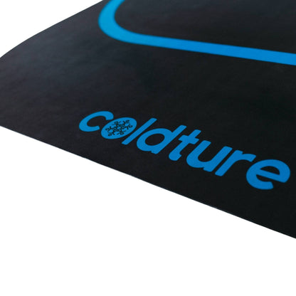 Close-up of the Coldture Dry Mat logo, featuring a sleek black surface with blue text and a snowflake design.