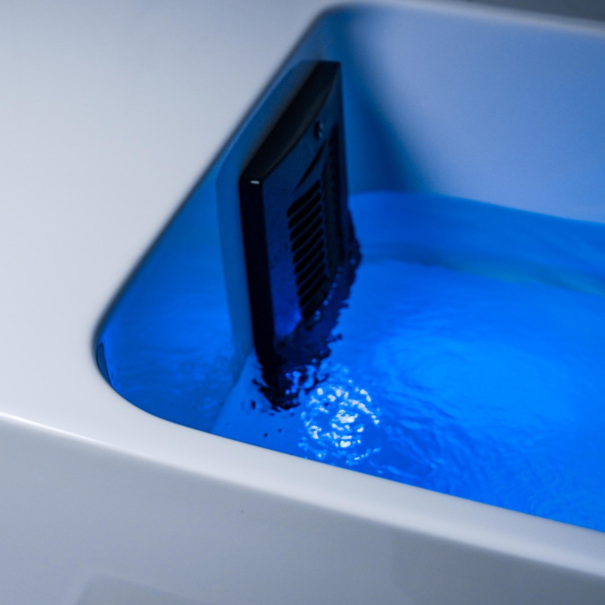 Close-up of the Coldture Pro Plunge featuring blue water and a sleek black design.