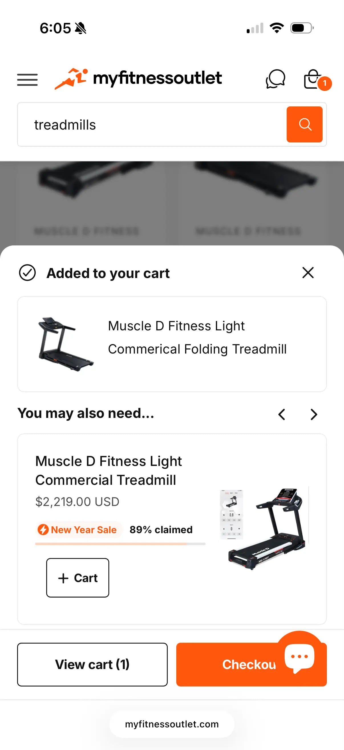 Black commercial folding treadmill with digital display console shown on product listing page with cart confirmation notification.