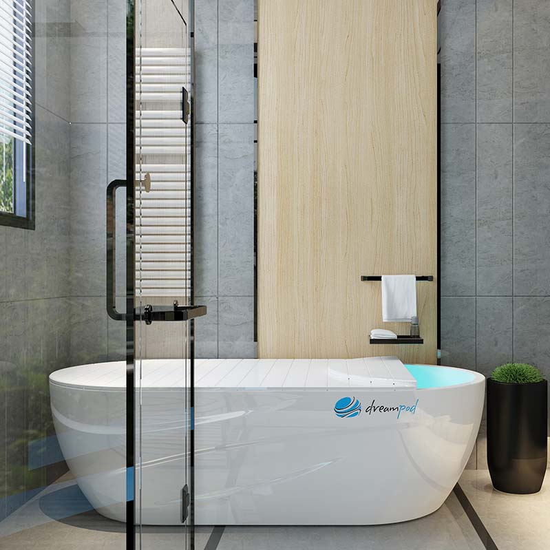 Modern bathroom featuring a sleek Dreampod Home Float Pro bathtub, surrounded by stylish decor and a glass shower enclosure.