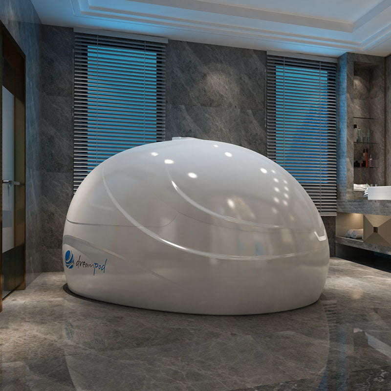 Dreampod Sport Float Pod in a modern interior setting with stone walls and natural light.