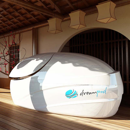 Dreampod V-Max Float Pod displayed in a serene indoor setting with wooden flooring and decorative lanterns.