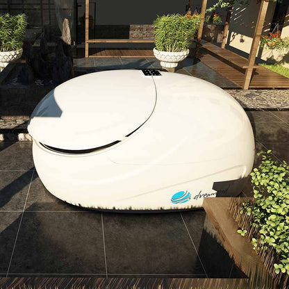 Dreampod V2 Float Pod in a serene outdoor setting, featuring a sleek white design and surrounded by greenery.