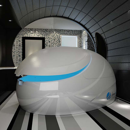 Dreampod V2 Float Pod in a modern, sleek interior space with black and white striped flooring and a mosaic wall.