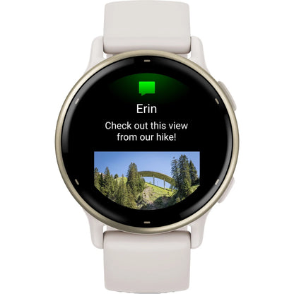 Smartwatch displaying a message from Erin that says 'Check out this view from our hike!' with a photo of a bridge surrounded by trees.