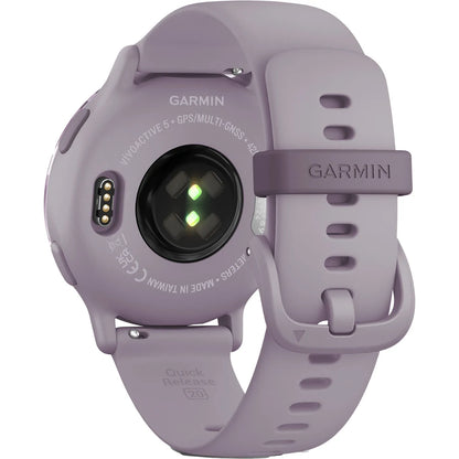 Image of the back of a Garmin Venu Active 5 smartwatch in a light purple color, showcasing the heart rate sensor and charging contacts.