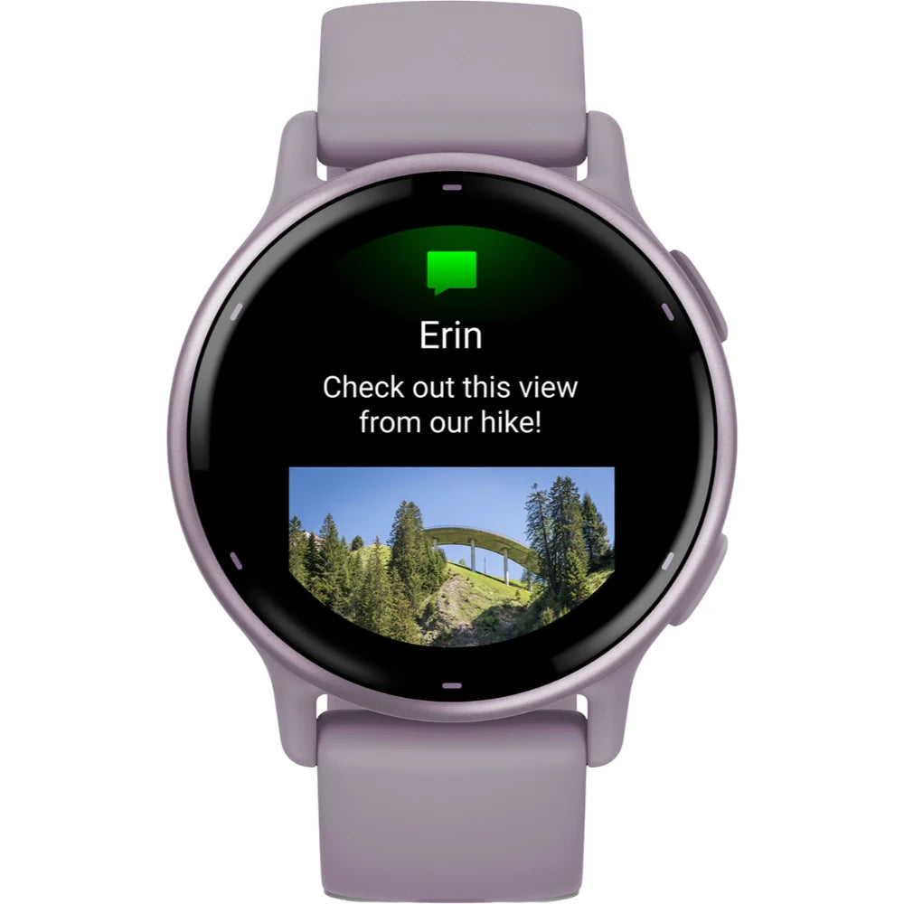 Smartwatch displaying a message from Erin with the text 'Check out this view from our hike!' along with a photo of a bridge surrounded by trees.