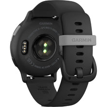 Close-up view of the back of a Garmin Vinoactive 5 smartwatch, highlighting the heart rate sensors and charging contacts, with a black silicone strap featuring a quick-release mechanism.