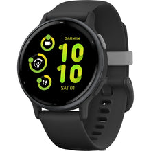 A Garmin smartwatch displaying a digital interface with green icons and numbers, showing the time as 10:10 and the date as Saturday, the 1st. The watch has a black strap and a sleek design.