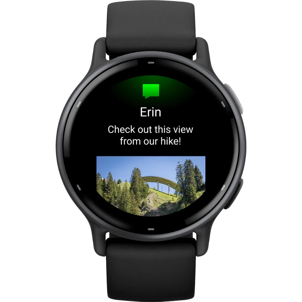Smartwatch displaying a message from Erin saying 'Check out this view from our hike!' with a photo of a scenic landscape featuring trees and a bridge.
