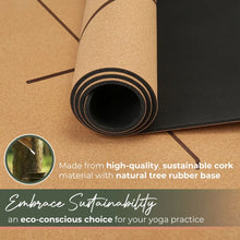 Rolled cork yoga mat with natural tan cork surface and black rubber base, shown from the end view with visible layers and a carrying strap.