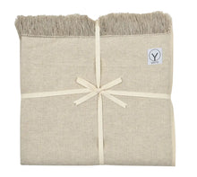 Cream-colored yoga blanket with textured hemp and organic cotton weave, fringed edges, tied with cream ribbon, and Gayo brand label visible.