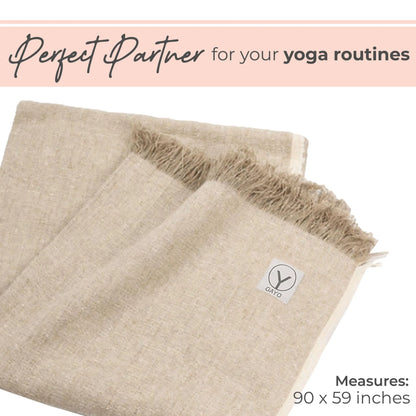 Beige hemp and organic cotton yoga blanket with fringe trim and brand label, measuring 90 x 59 inches.