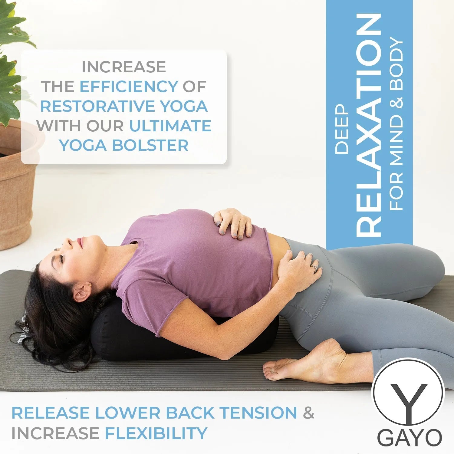 Woman lying on a gray yoga mat resting her head and torso on a gray cylindrical yoga bolster while performing a restorative yoga pose.