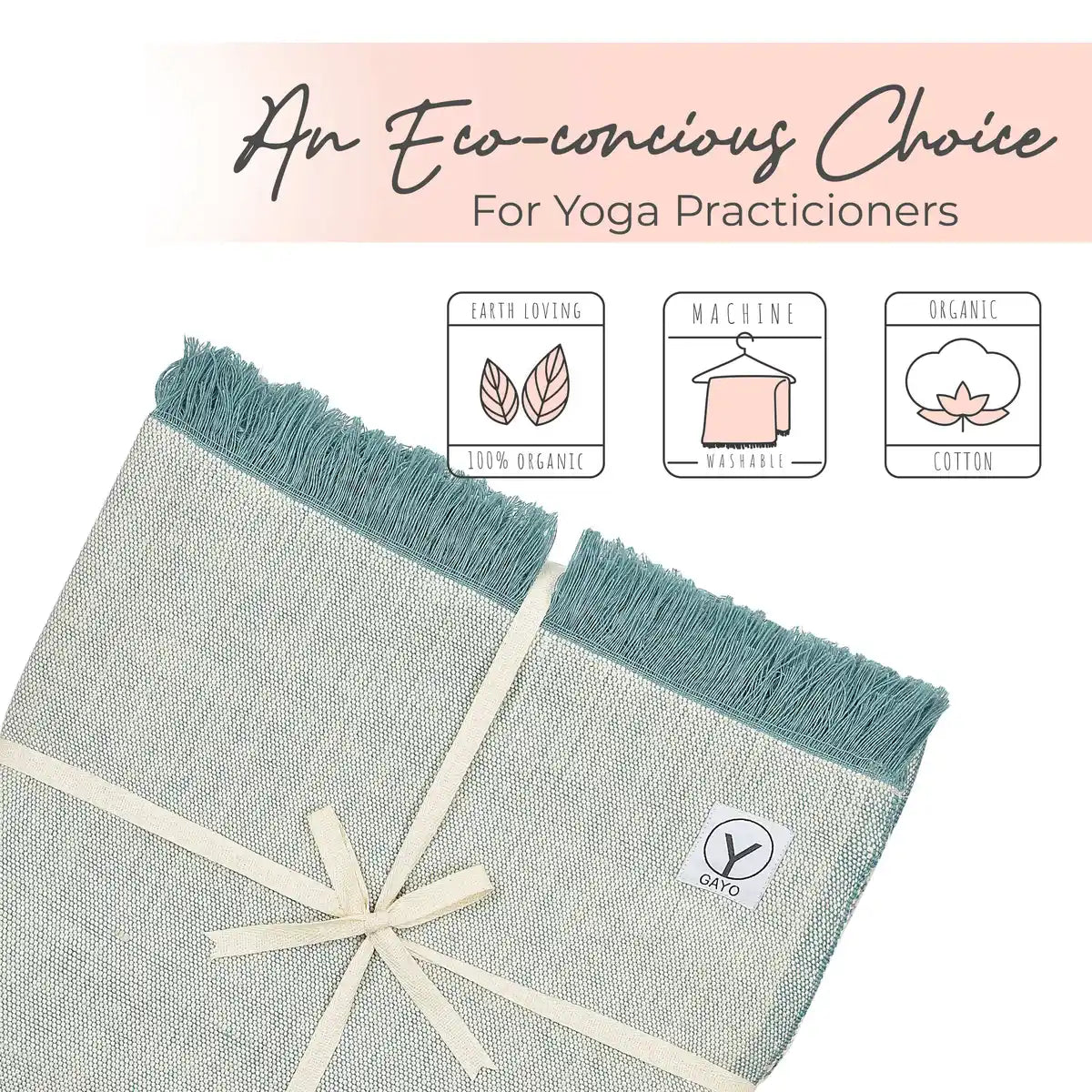 Two organic cotton yoga blankets with teal fringe edges and cream binding, displayed flat on a pink background. Product features icons highlight earth-loving 100% organic material, machine washable care, and organic cotton composition.