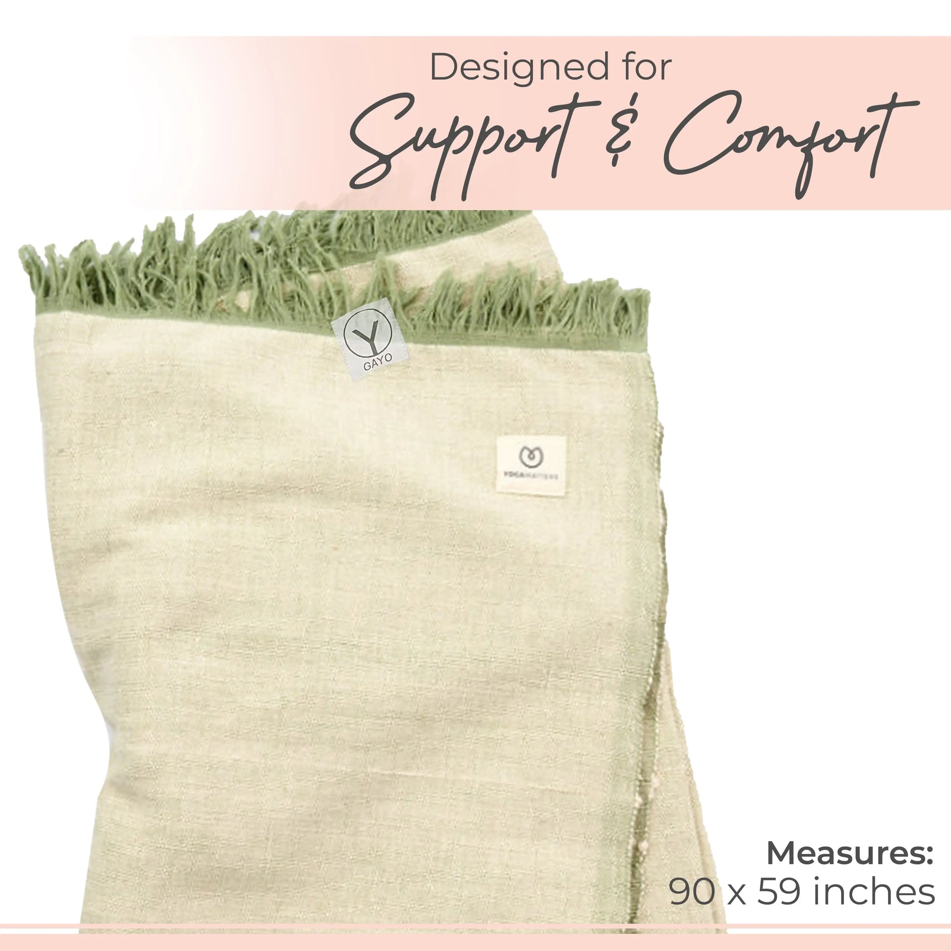 Cream organic cotton yoga blanket with green fringe trim and branded label, measuring 90 x 59 inches.
