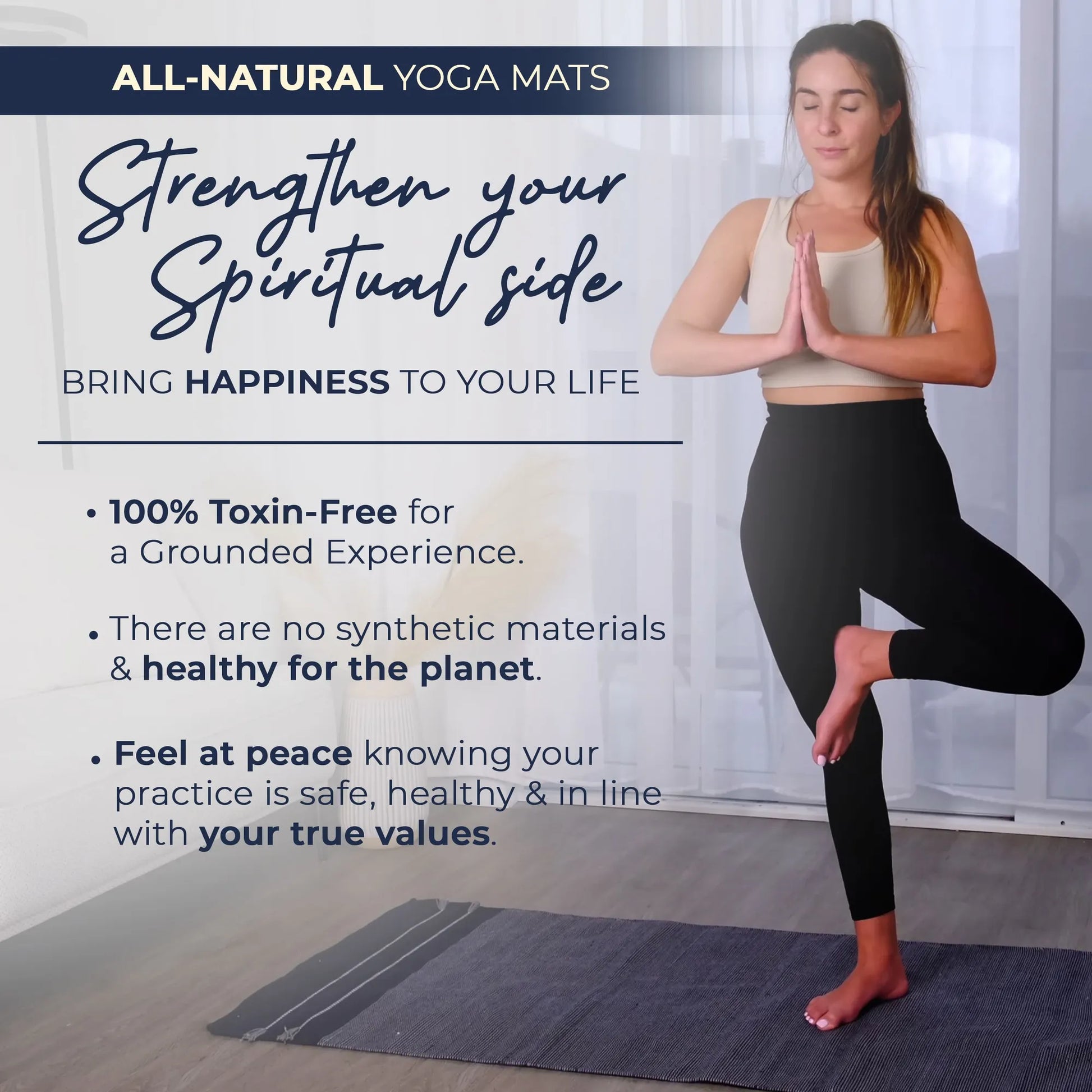 Woman performing a yoga pose on a dark gray organic cotton yoga mat in a bright studio space.