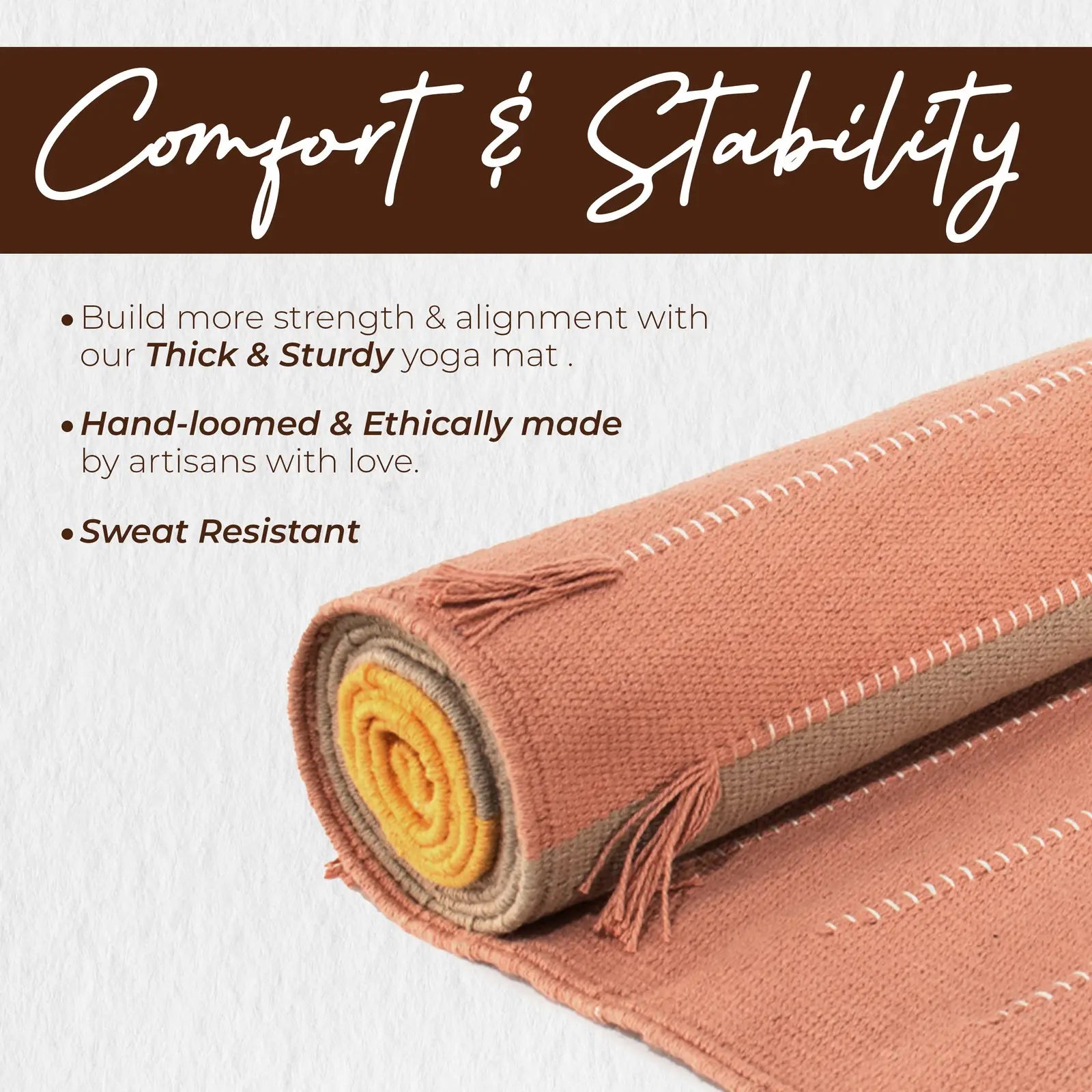 Rolled organic cotton yoga mat with terracotta outer fabric, yellow and beige inner layers, and decorative fringe trim visible on the end.