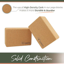 Two natural cork yoga blocks with rounded edges and engraved GAYO logo, shown from different angles against white background with close-up detail of high-density cork material.