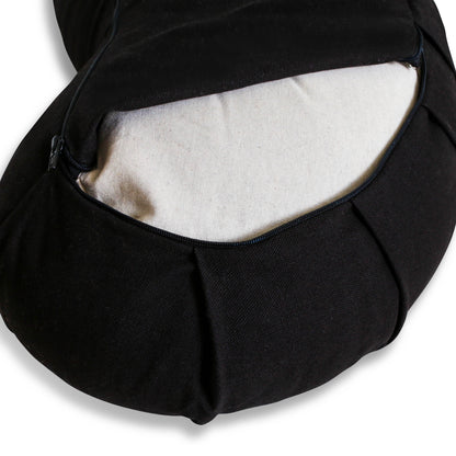 Close-up of black fabric bag with zipper open, beige interior.