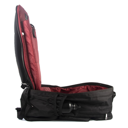 Open black backpack with red padded interior and water bottle holder.