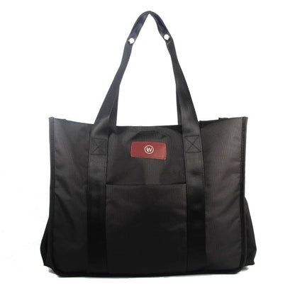 Black tote bag with two handles and a red logo patch.