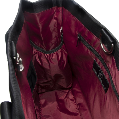 Black bag interior with burgundy lining, pockets and a zipper.