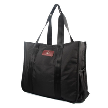 Black tote bag with dual handles and side pocket.