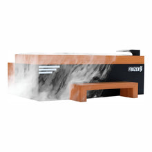 A modern cryotherapy machine named 'Frozen 9' with a sleek black and wood design, emitting vapor, featuring a bench for user comfort.