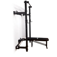 Black wall-mounted foldable Murphy power rack with bench.