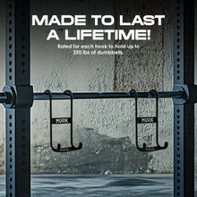 Two hooks labeled “MVRK” on a squat rack in a gym setting.