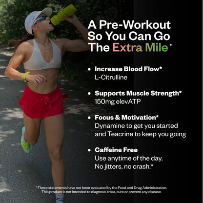 Woman drinking from a neon yellow bottle while jogging outdoors, wearing a white cap, light gray sports bra, and red shorts with neon yellow sneakers.