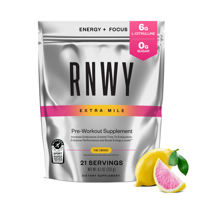 Silver resealable pouch of RNWY Extra Mile pre-workout supplement in pink lemonade flavor, labeled with 6g L-citrulline, 0g sugar, 21 servings, and featuring a pink and yellow accent band with a fresh lemon and grapefruit slice displayed beside it.
