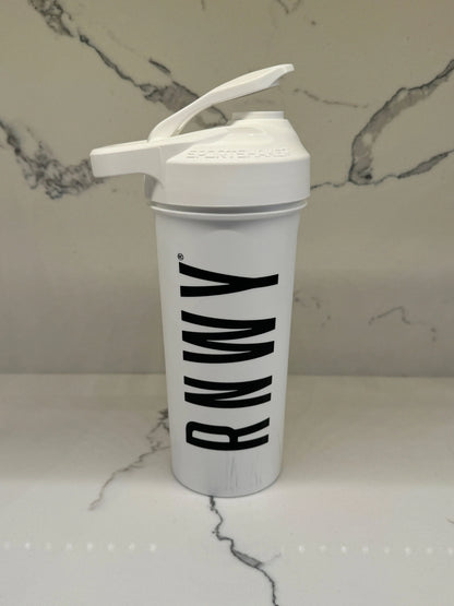 White shaker bottle with black diagonal stripe design and flip-top lid on marble background.