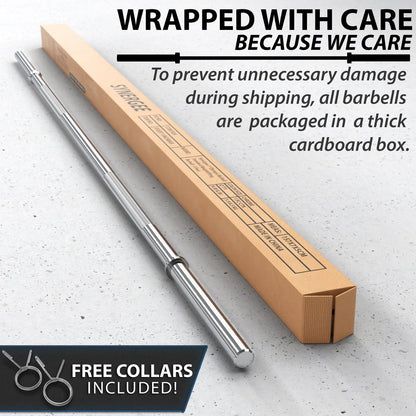 Chrome barbell with knurled grip partially removed from a tan cardboard shipping box on a concrete surface. Free collars included with the barbell.